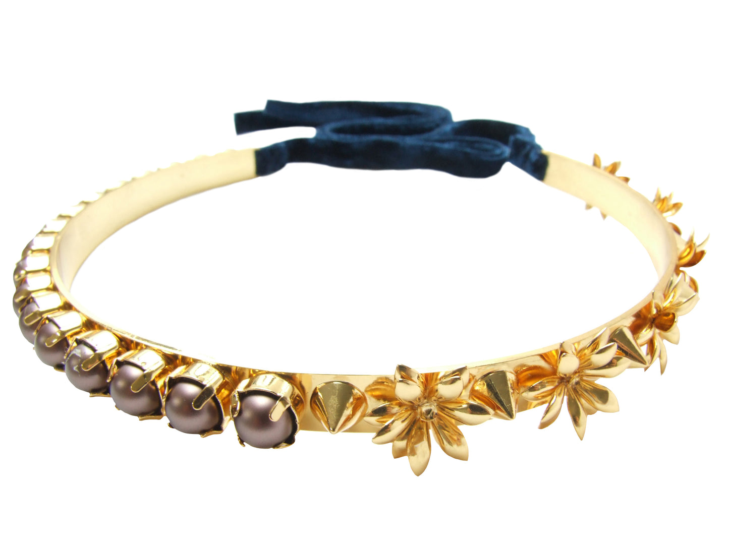 Dipped in gold Jasmine metal choker is embellished with flowers, spikes and velvet brown Swarovski pearls. Fastens at the back with a luxurious velvet ribbon. 